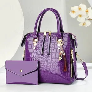 Deep purple crocodile pattern handbag set with glossy finish and tassel detail