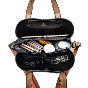 Spacious brown and black bucket bag showing organized interior compartments with wide strap