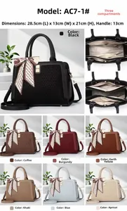 Detail view of stylish tote bag with 3 compartments and decorative silk scarf accessory