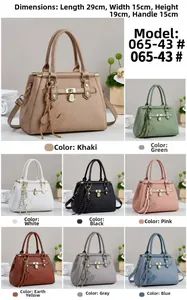 Detailed view of tote bag dimensions 29x15x19cm with tassel and woven texture details