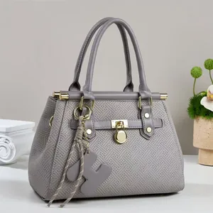 Gray large tote bag with geometric H-pattern embossing and gold hardware detail