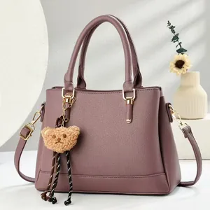 Retro Boston bag in dusty pink faux leather with plush bear charm and crossbody strap
