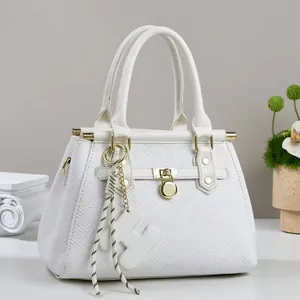 White tote bag with geometric texture, golden hardware, and stylish H-pendant decoration