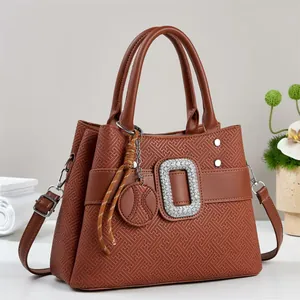 Brown embossed leather tote with diamond buckle and detachable shoulder strap