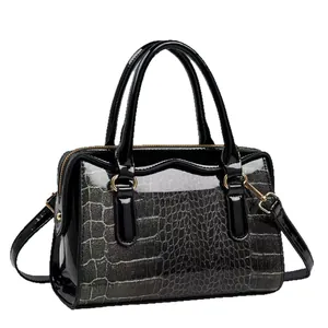 Elegant black glossy faux leather Boston bag with silver crocodile pattern texture detail