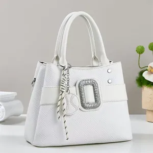 Elegant white embossed handbag for women with diamond-encrusted buckle and side strap rings
