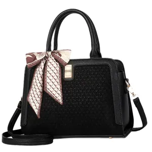 Elegant black crossbody handbag with V-weave texture and decorative silk scarf for women