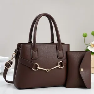 Dark brown leather handbag set with gold horsebit hardware and matching long wallet