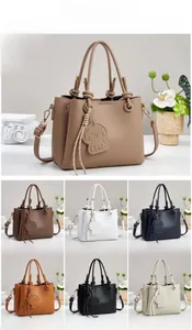 Litchi pattern bucket bag dimensions 24x11x19cm featuring knot handle and puppy charm