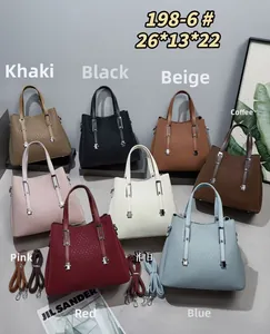 Multiple colors of glitter textured tote bags with leather straps and top handles