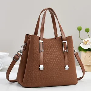 Caramel brown faux leather tote bag with woven texture and adjustable shoulder strap