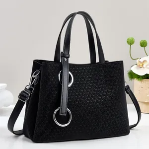 Premium black woven tote bag with silver rings and adjustable strap for women