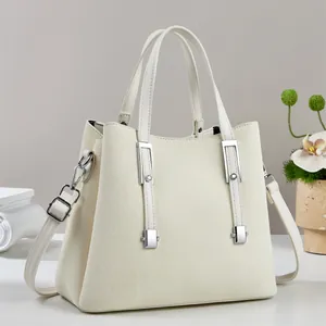 Minimalist beige woven tote bag with adjustable shoulder strap and silver hardware accents