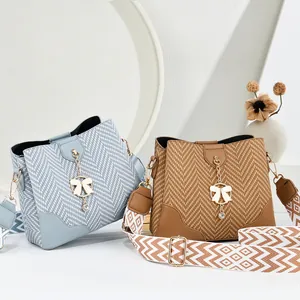 Fashionable woven texture bucket bags in blue and brown with detachable geometric straps