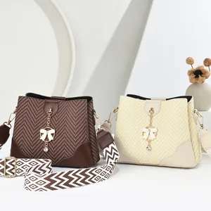 Chic women's bucket bag with chevron texture and patterned wide shoulder strap