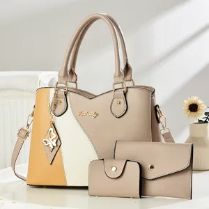 Three-piece women's handbag set with tricolor patchwork design and butterfly charm