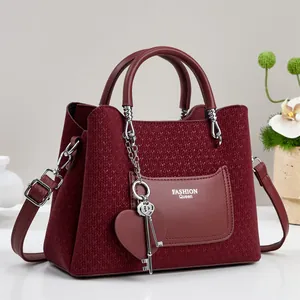 Burgundy minimalist contrast panel handbag with heart charms and large capacity for women