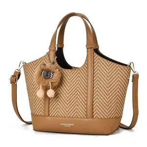 Brown woven tote bag with PU leather trim and adjustable shoulder strap for daily commuting