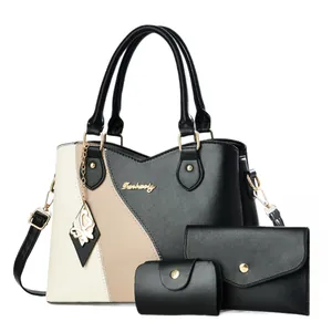 Three-piece women handbag set with color-block tote, black wallet, and small coin purse