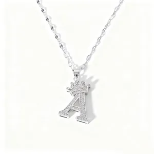 Close-up view of the sparkling rhinestone crown letter A pendant necklace with delicate chain.