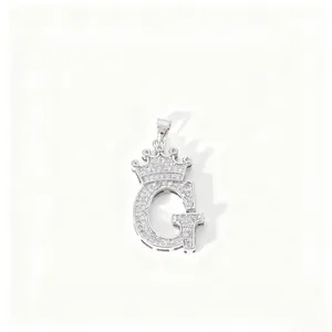 Detailed close-up view of the exquisite letter G crown pendant encrusted with sparkling zirconia.