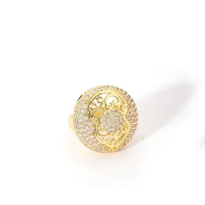 Macro detail of gold plated open ring with hollow design and pave crystal stones