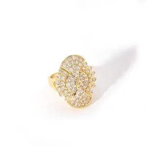 Macro detail of large gold heart ring with micro-paved sparkling white zircon stones