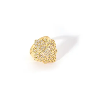 Macro view of gold flower geometric ring featuring sparkling pavé zircon detailing