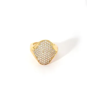 Detailed close-up of a gold-plated stainless steel ring with pavé crystals and pearls