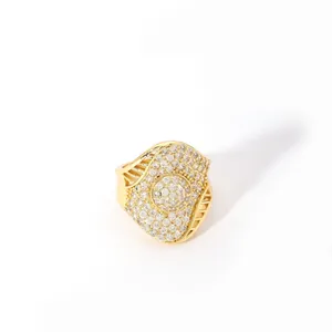 Macro detail of gold plated statement ring featuring dense pave setting and cutout patterns