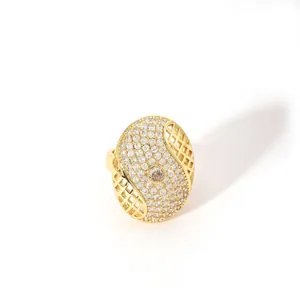 Macro detail of gold adjustable ring with pavé pavé-set stones and large round center gem