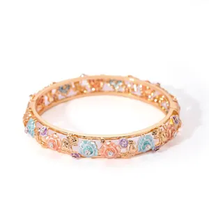 Detailed view of Cloisonne floral bangle featuring rose relief and sparkling rhinestones