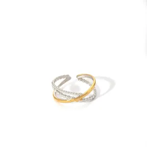 Detailed view of layered geometric open ring with silver beads and gold band