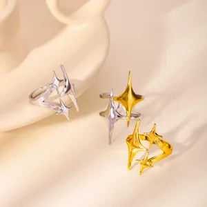 Minimalist gold and silver star-shaped open rings with a modern radiant design