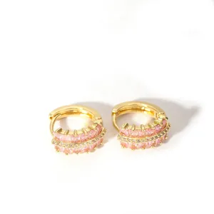 Detail of 18K gold-plated huggie earrings with pink zircon and white crystal pave setting