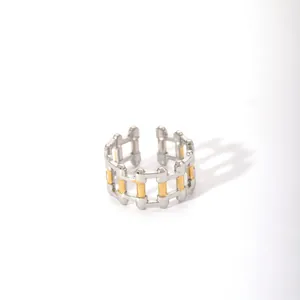 Detailed view of bicolor silver and gold geometric hollow chain link ring for women