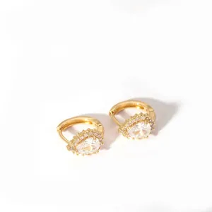 Detail view of 18K gold plated hoop earrings with pear-cut zircon halo setting