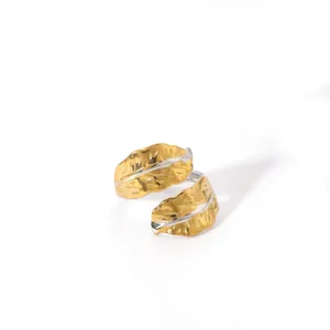 Detail of leaf ring showing dual-tone gold and silver finish with realistic vein texture