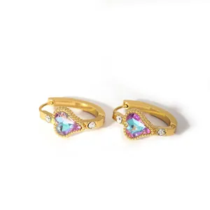 Detail view of 18K gold heart hoop earrings with iridescent crystals and zircon accents