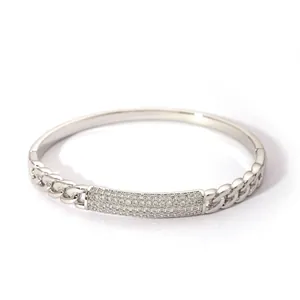 Macro shot of silver-toned Cuban chain bracelet with rectangular zircon inlay
