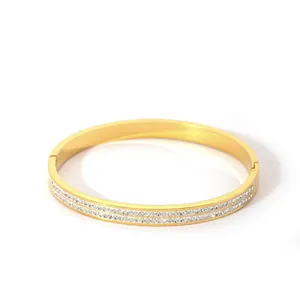 Polished 18K gold-plated stainless steel bangle with double row of pavé crystals