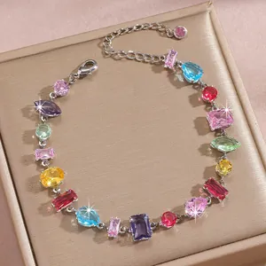 Macro detail of multi-colored zircon stones in various cuts on a metallic chain