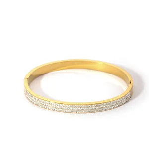 Macro view of 18K gold plated stainless steel bracelet with triple row zircon inlay