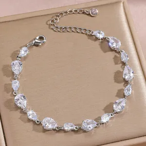 Close-up of teardrop zircon bracelet with silver lobster clasp and adjustable link chain