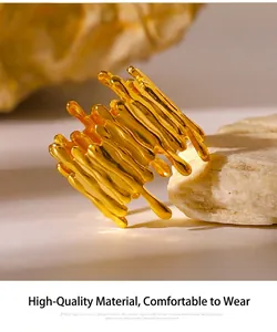 Macro detail of gold molten lava style ring on stone showing liquid metal texture