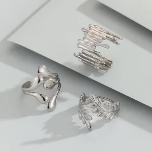 Three-piece set of silver stainless steel open rings with lava and fluid wave textures