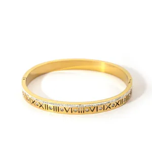 Gold plated open bangle with Roman numerals and micro-set cubic zirconia accents