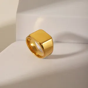 Minimalist gold plated stainless steel signet ring with a polished flat rectangle face