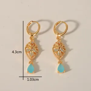 Gold-plated drop earrings with sky blue water drop stones and hollow geometric design