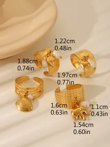 Detailed view of adjustable gold rings featuring shell and elephant charms with pearls